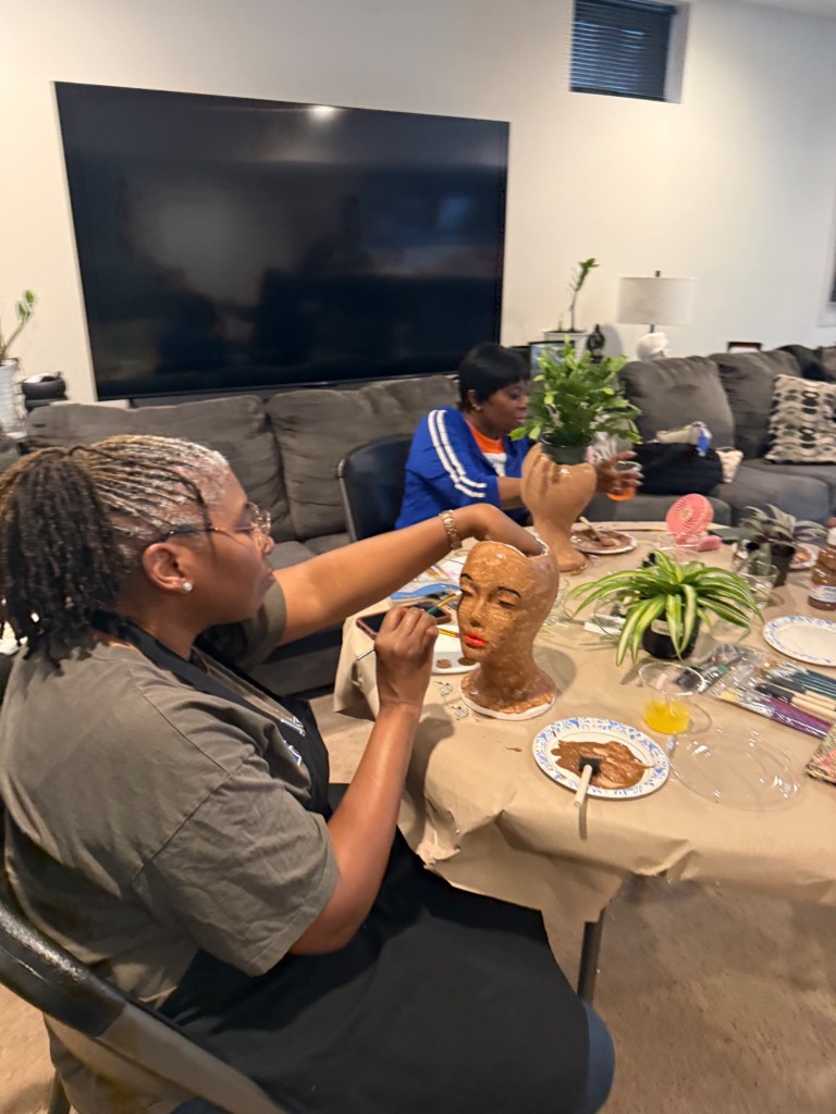 Guest painting a face planter during the workshop