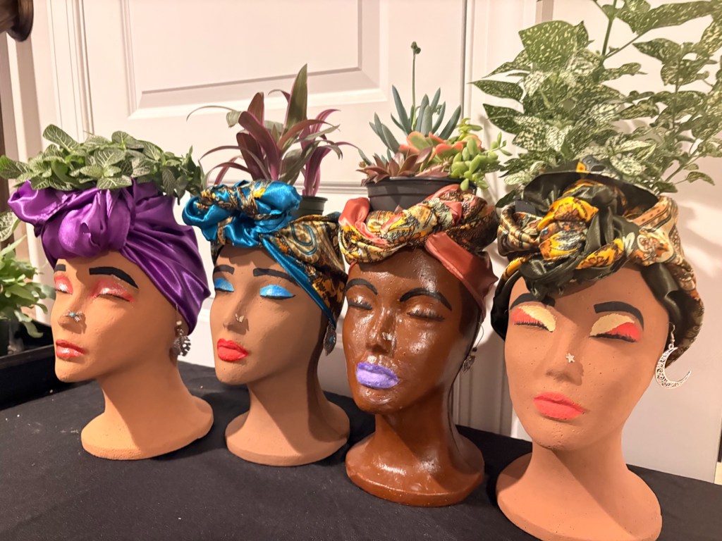Finished hand-painted face planters with plants